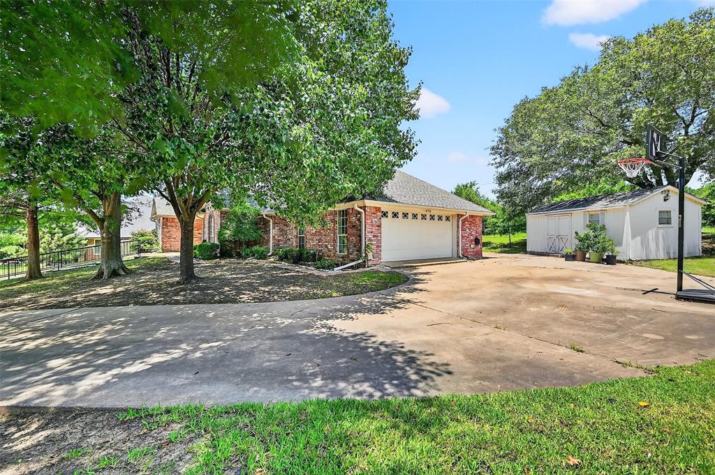 2107 Meadows Circle Sherman, TX 75092 - Photo 27 of 36 a sign board with yard