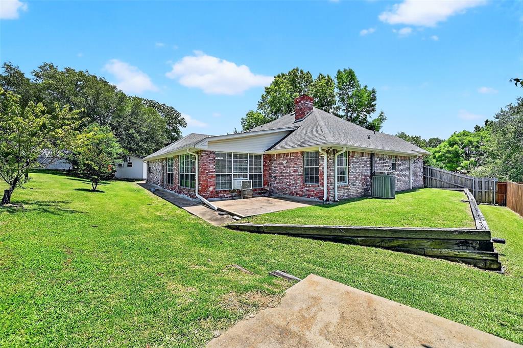 2107 Meadows Circle Sherman, TX 75092 - Photo 29 of 36 a view of a house with a big yard