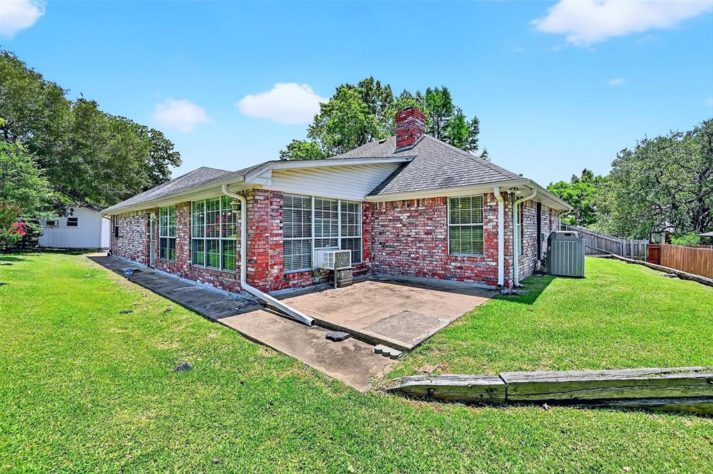 2107 Meadows Circle Sherman, TX 75092 - Photo 30 of 36 a view of a house with a yard and sitting area