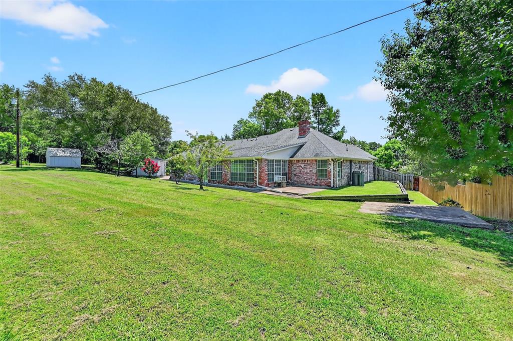 2107 Meadows Circle Sherman, TX 75092 - Photo 31 of 36 a front view of a house with yard and green space