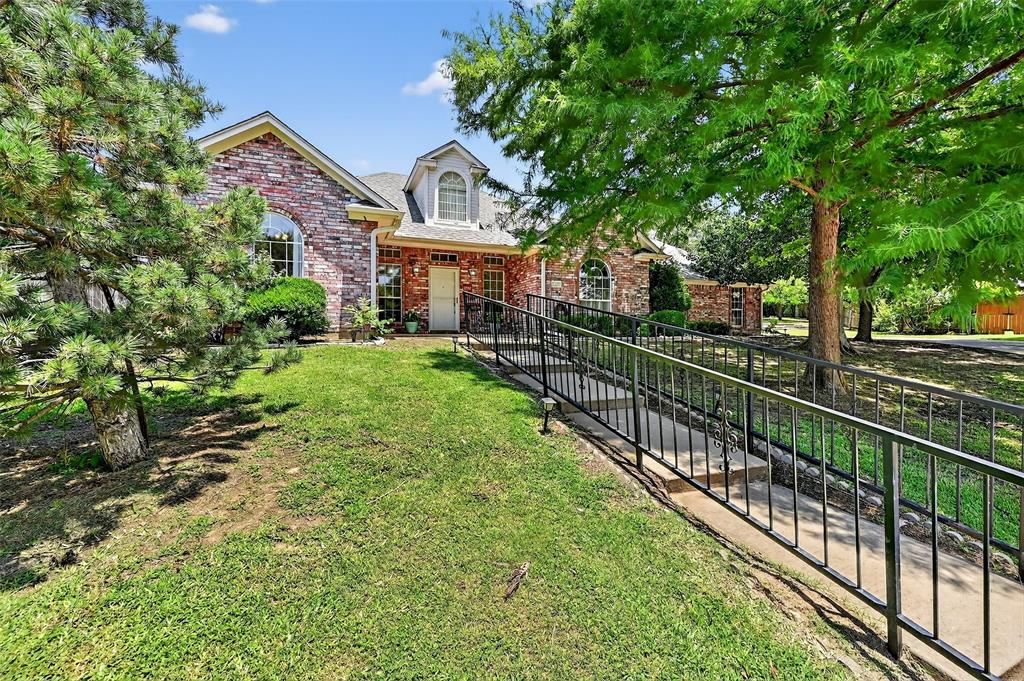 2107 Meadows Circle Sherman, TX 75092 - Photo 35 of 36 a view of a house with a small yard and large trees