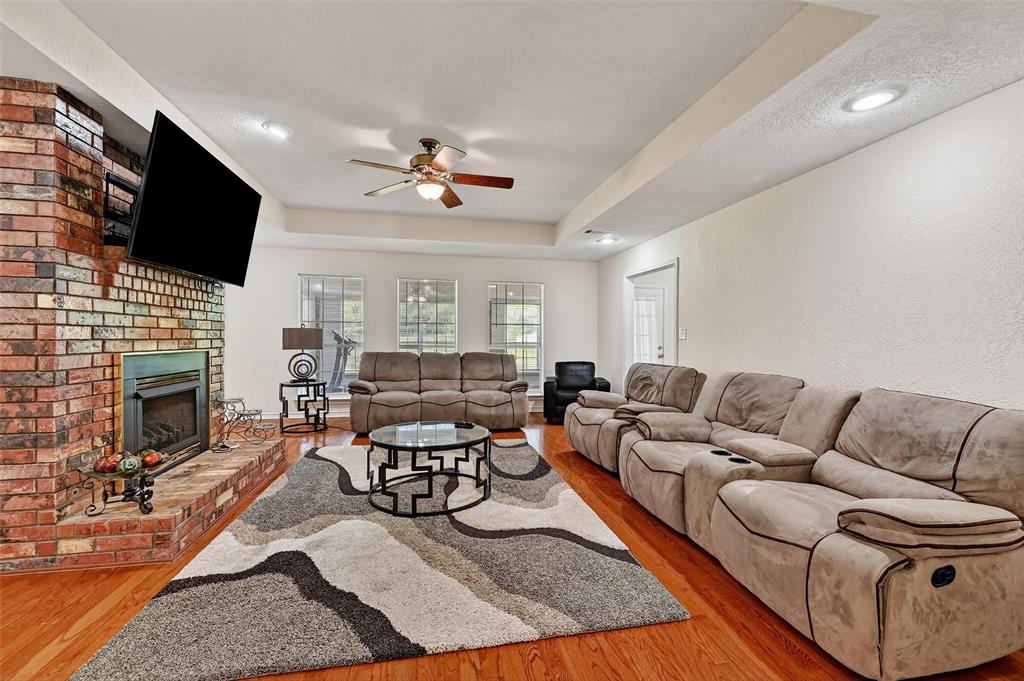 2107 Meadows Circle Sherman, TX 75092 - Photo 5 of 36 a living room with furniture fireplace and flat screen tv