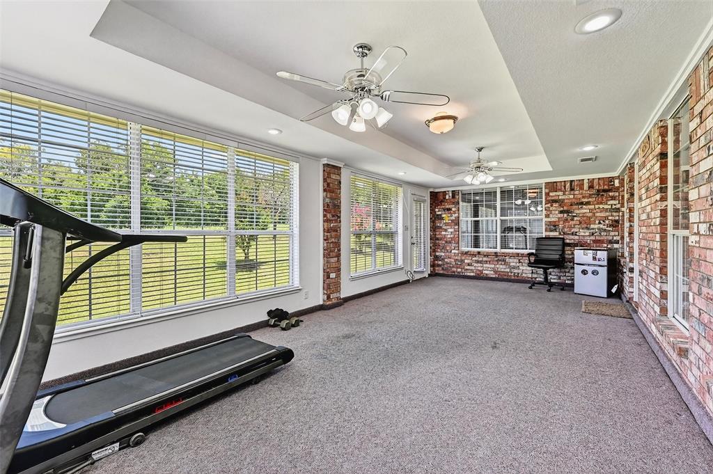 2107 Meadows Circle Sherman, TX 75092 - Photo 9 of 36 a living room with furniture and a large window