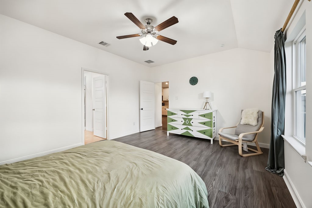 4431 Upland Stream Lane Katy, TX 77493 - Photo 11 of 17 a bedroom with a bed and a chandelier