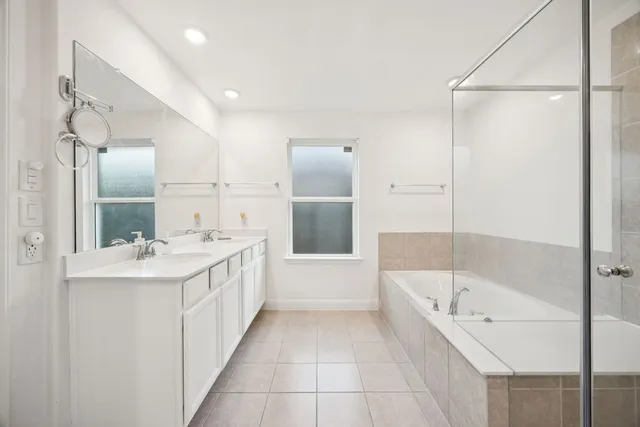 a bathroom with a bathtub and a sink