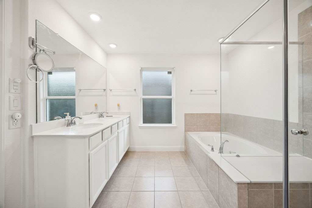 4431 Upland Stream Lane Katy, TX 77493 - Photo 12 of 17 a bathroom with a bathtub and a sink