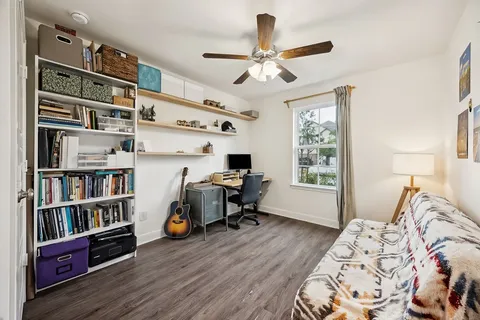 a bedroom with furniture closet and a window