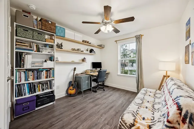 a bedroom with furniture closet and a window