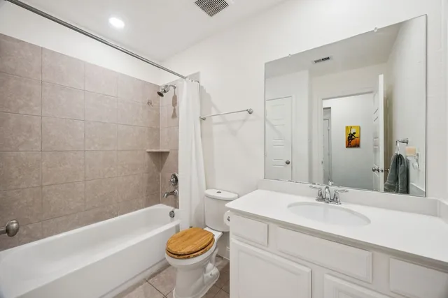 a bathroom with a sink a toilet and a bathtub