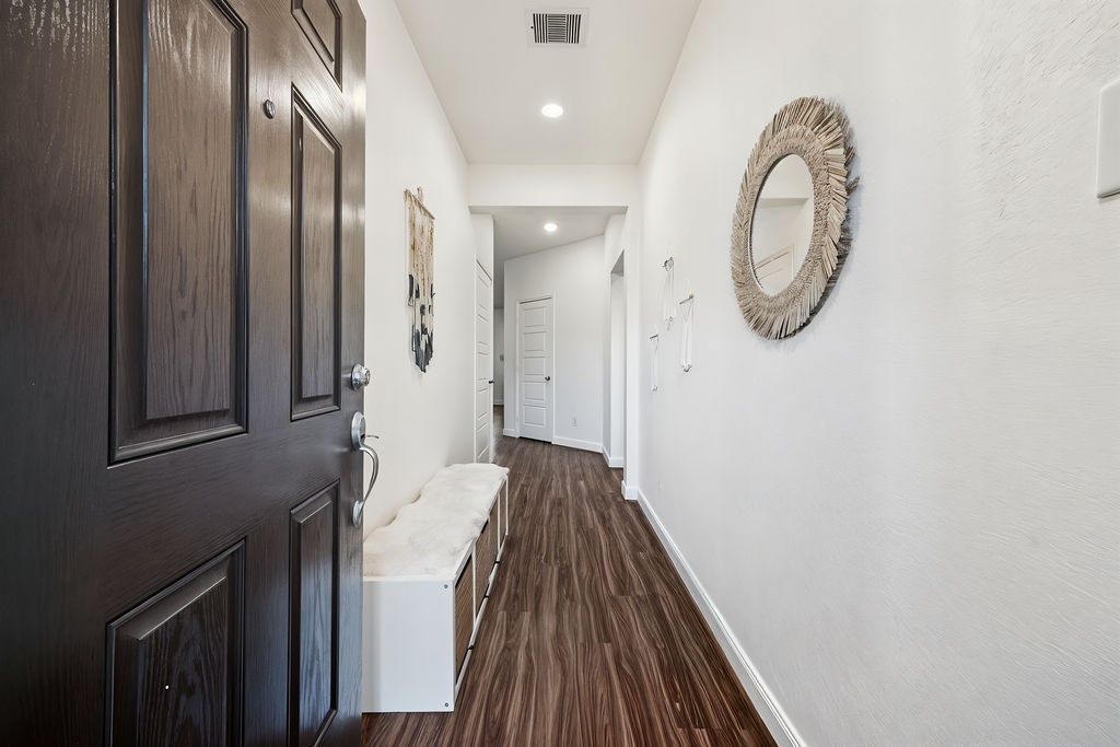 4431 Upland Stream Lane Katy, TX 77493 - Photo 2 of 17 a view of a hallway with wooden floor