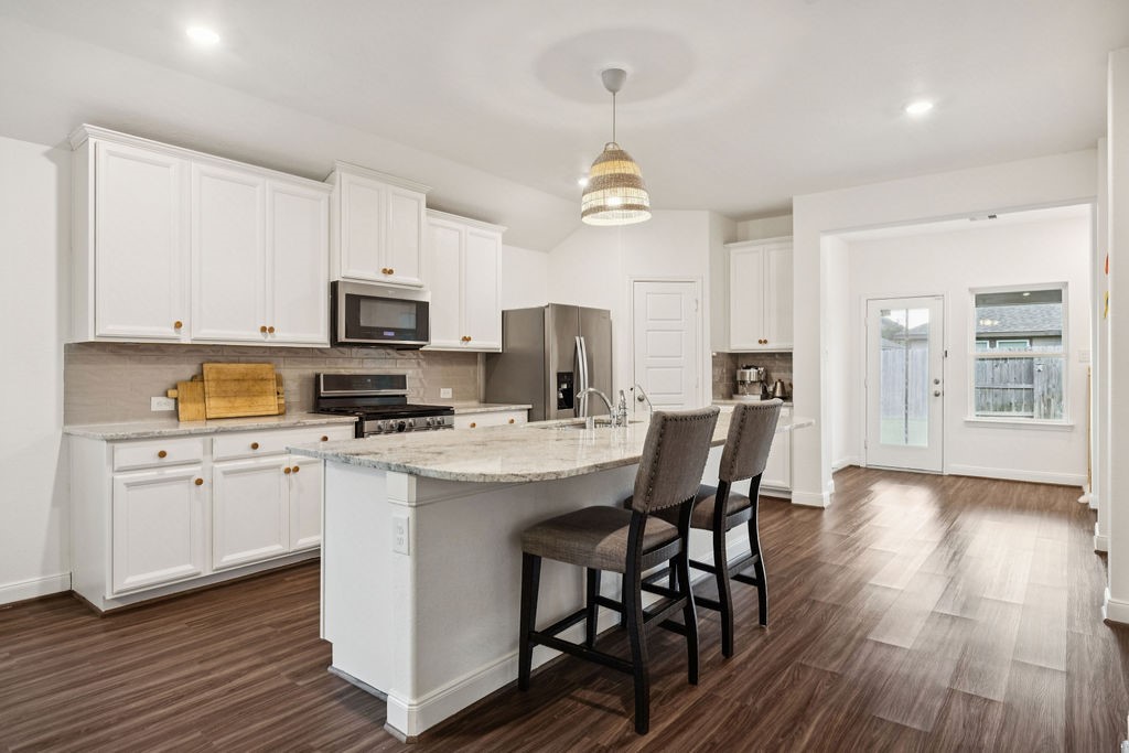 4431 Upland Stream Lane Katy, TX 77493 - Photo 7 of 17 a view of kitchen with sink microwave and cabinets