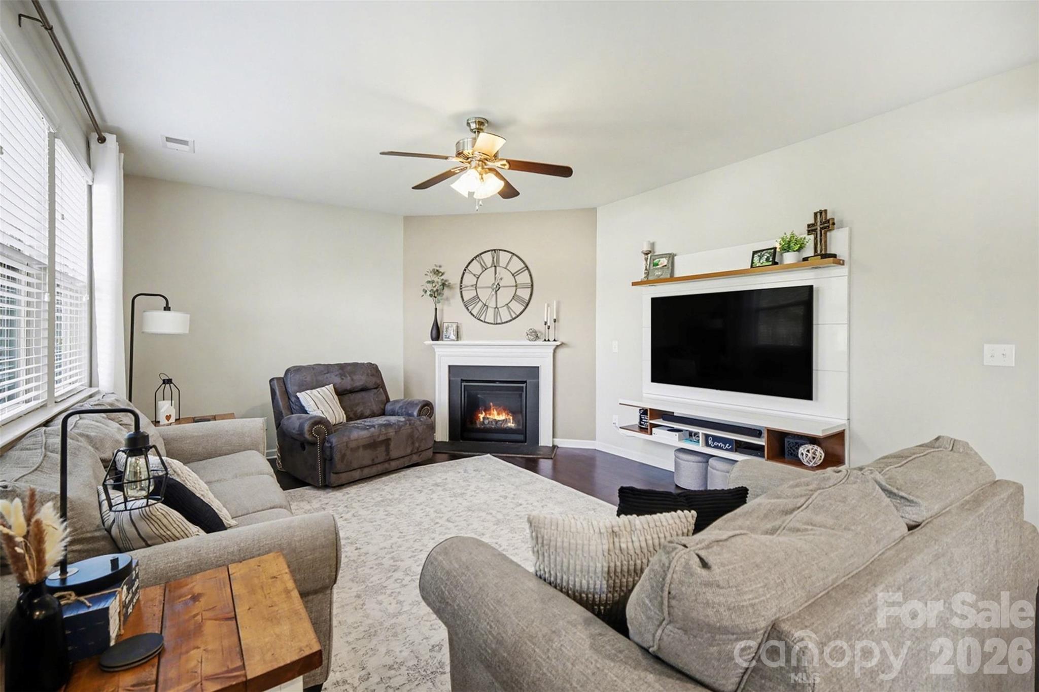 514 Tack Lane Midland, NC 28107 - Photo 18 of 48 a bedroom with furniture a flat screen tv and a fireplace