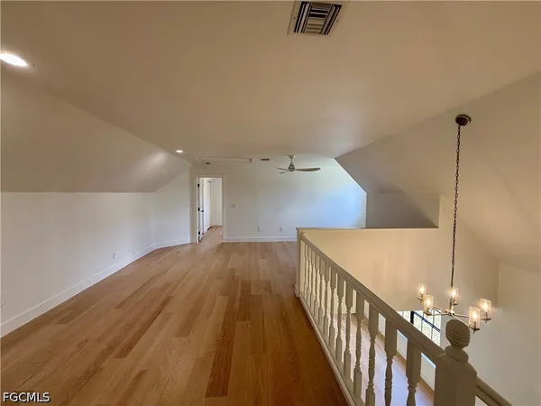 a view of a hallway with staircase