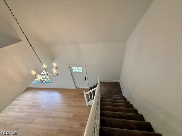 a view of a hallway with stairs
