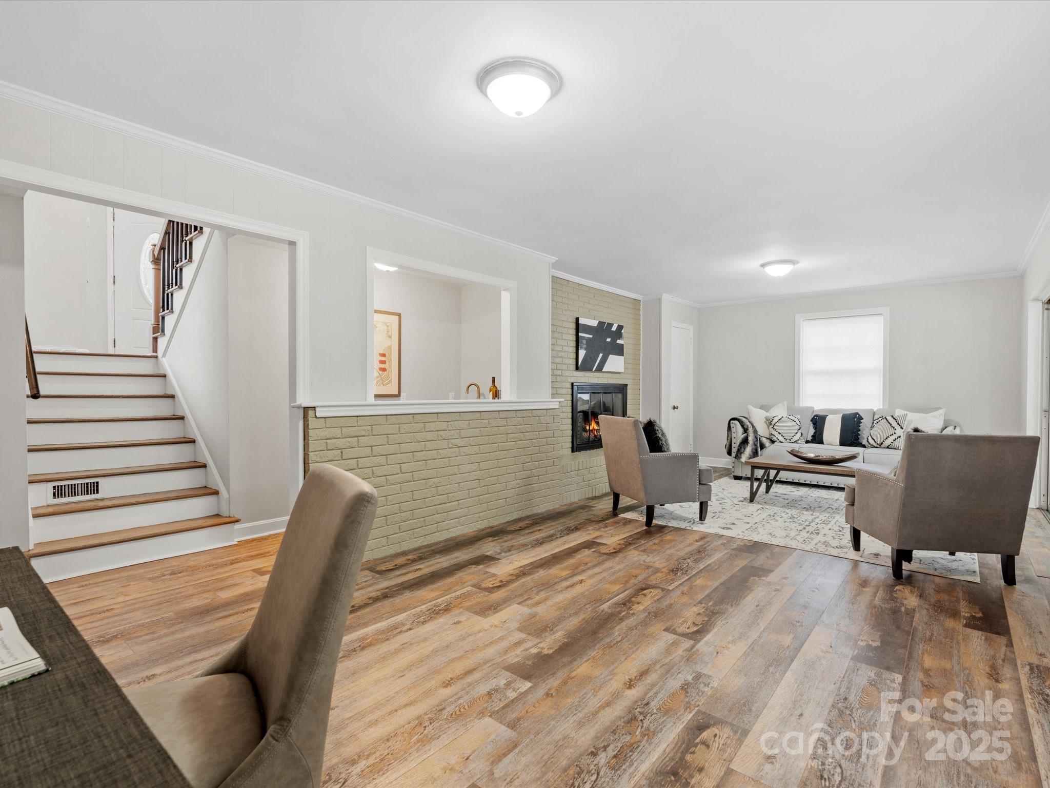 122 Lansdowne Road Charlotte, NC 28270 - Photo 13 of 21 a living room with furniture and wooden floor