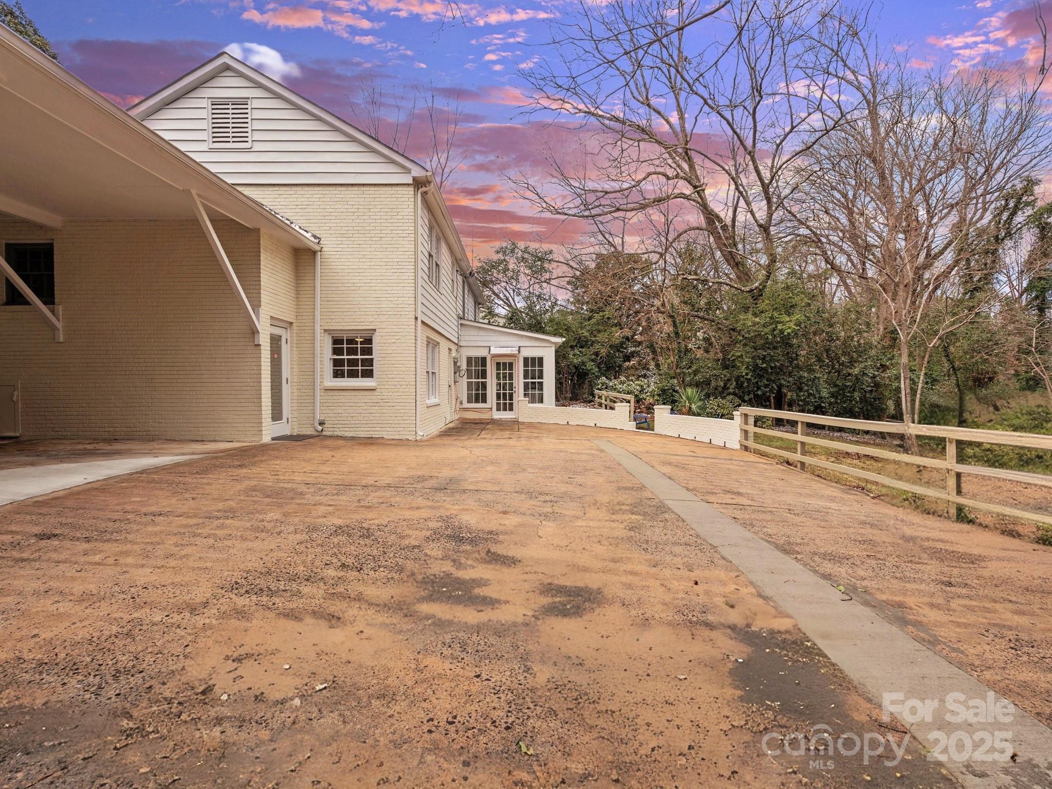 122 Lansdowne Road Charlotte, NC 28270 - Photo 20 of 21 a view of house with yard and trees in the background