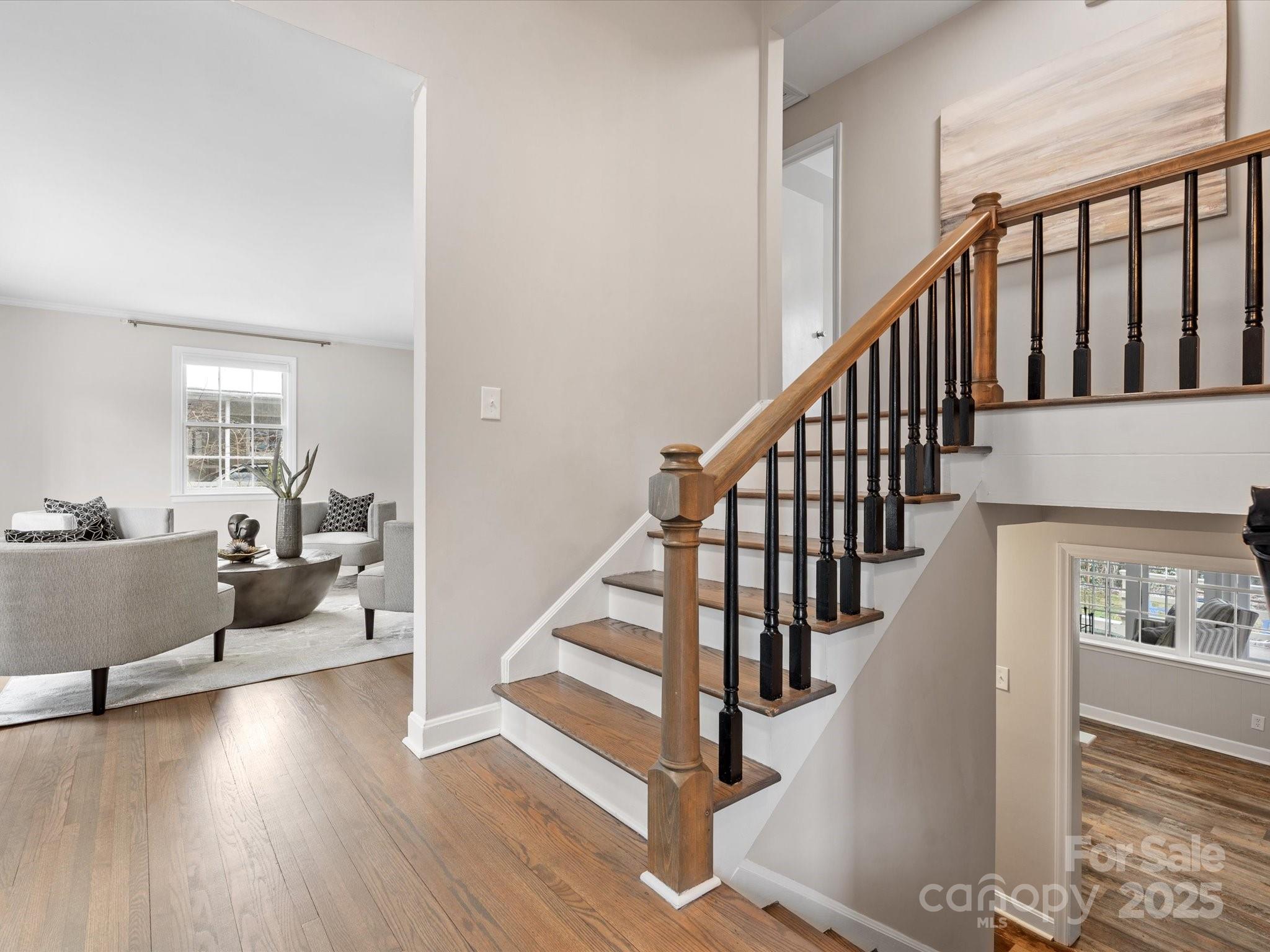 122 Lansdowne Road Charlotte, NC 28270 - Photo 5 of 21 a view of entryway and hall with wooden floor