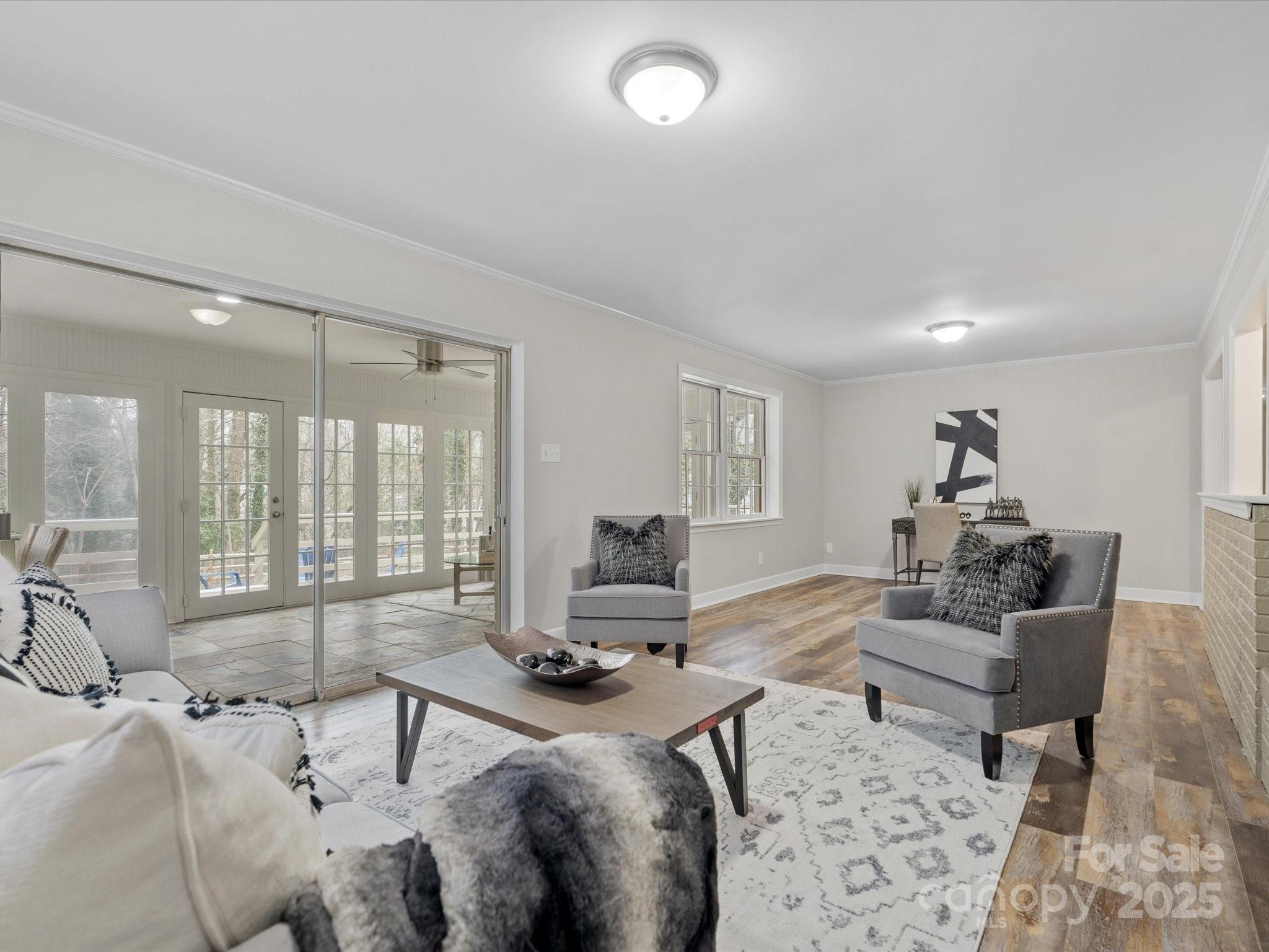 122 Lansdowne Road Charlotte, NC 28270 - Photo 8 of 21 a living room with furniture and a large window