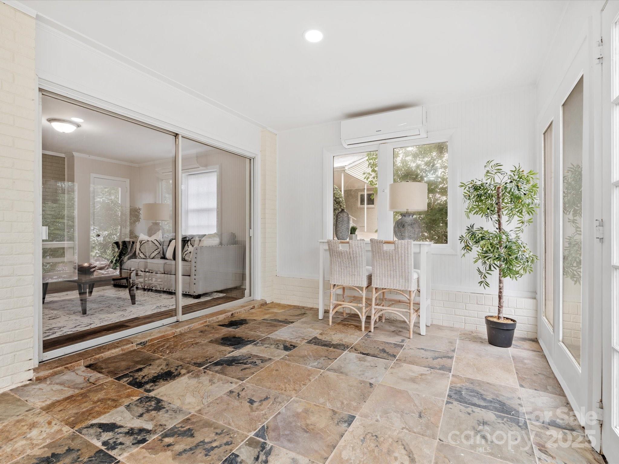 122 Lansdowne Road Charlotte, NC 28270 - Photo 9 of 21 a view of a livingroom with furniture and floor to ceiling window