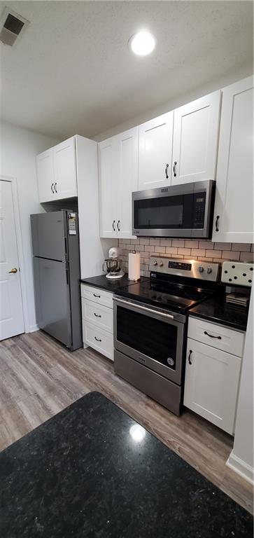 216 Stockton Ridge Cranberry Township, PA 16066 - Photo 11 of 25 a kitchen with a stove and a microwave