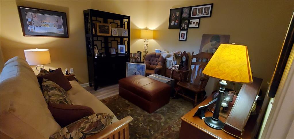 216 Stockton Ridge Cranberry Township, PA 16066 - Photo 18 of 25 a living room with furniture and a lamp