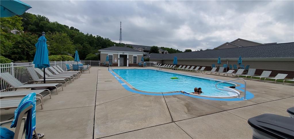 216 Stockton Ridge Cranberry Township, PA 16066 - Photo 22 of 25 a view of a house with pool and chairs