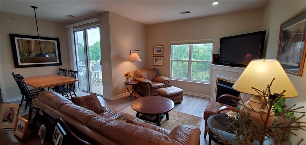 216 Stockton Ridge Cranberry Township, PA 16066 - Photo 4 of 25 a living room with furniture a flat screen tv and a large window