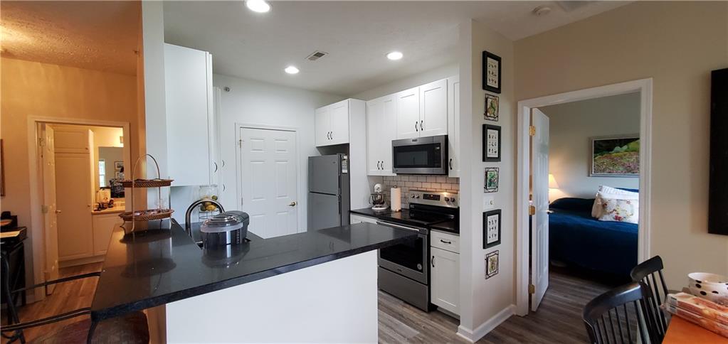 216 Stockton Ridge Cranberry Township, PA 16066 - Photo 9 of 25 a kitchen with white cabinets and appliances