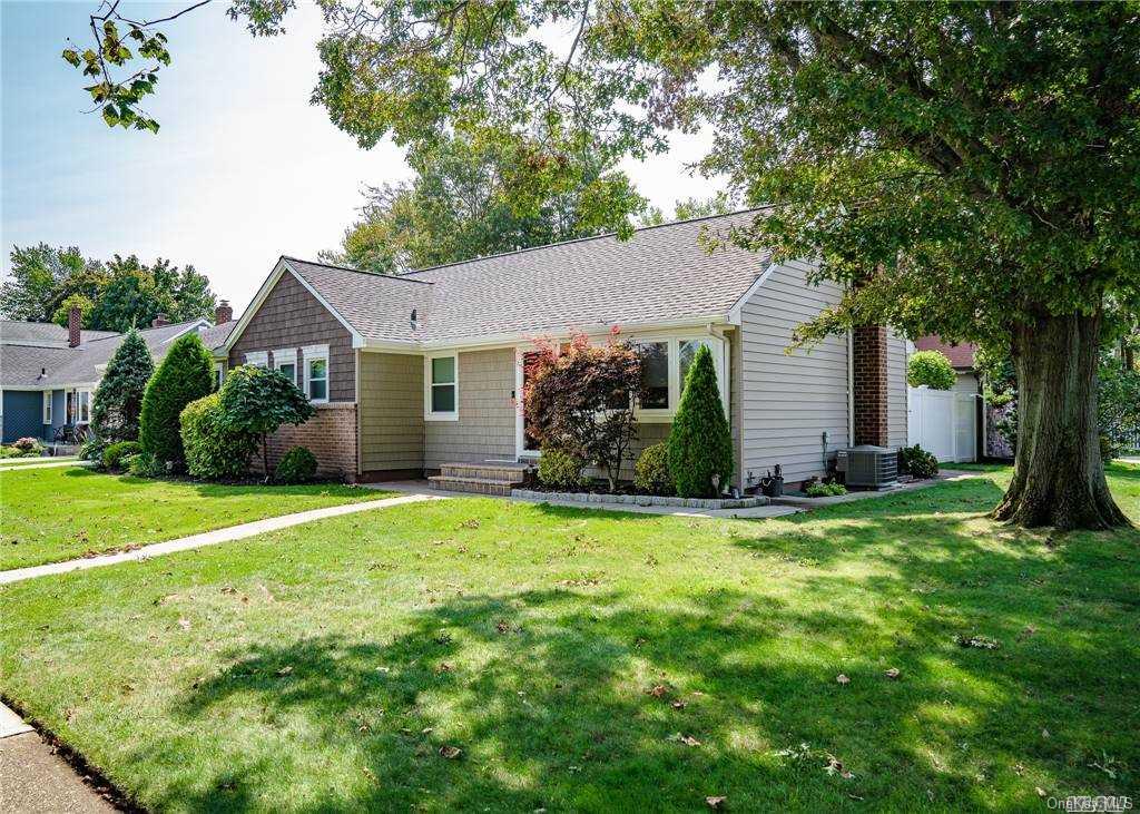 726 Preston Road East Meadow, NY 11554 - Photo 1 of 1 a front view of a house with a garden
