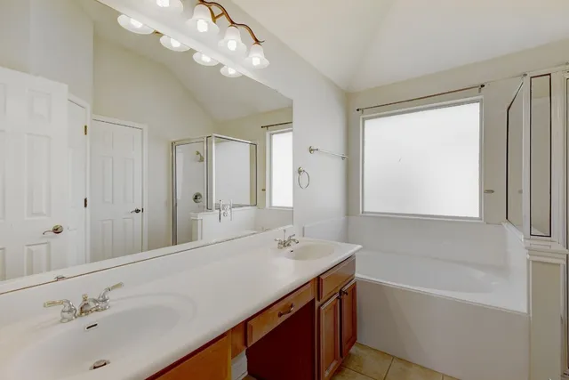 a bathroom with a bathtub and a sink