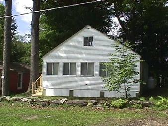 101 Shore Road Richmond, MA 01201 - Photo 1 of 1 a front view of a house with a yard