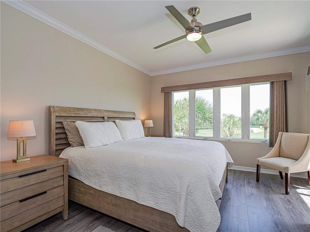 5060 Harmony Circle, Unit 304 Vero Beach, FL 32967 - Photo 18 of 36 a bedroom with a bed and a couch