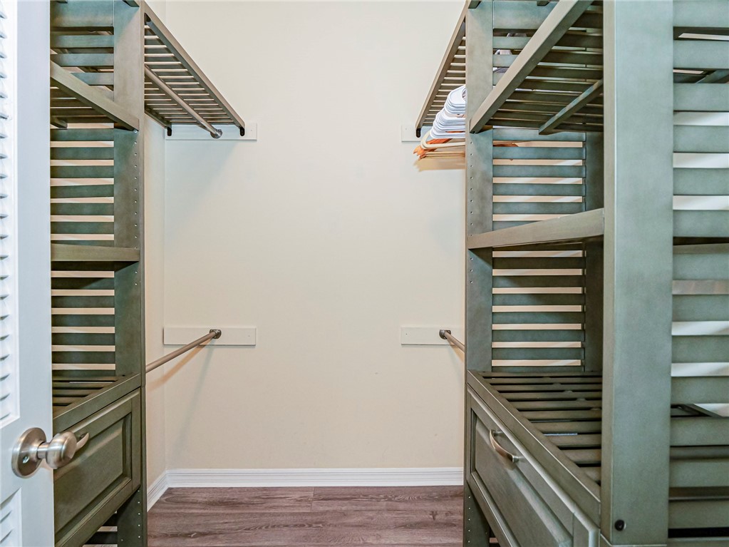 5060 Harmony Circle, Unit 304 Vero Beach, FL 32967 - Photo 24 of 36 a view of entryway and hall with wooden floor