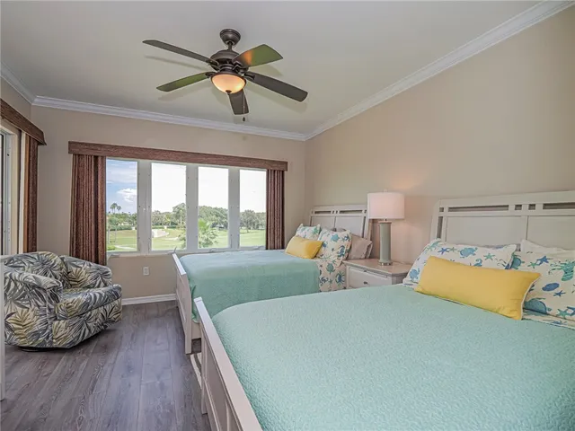 a bed room with a bed and a large window