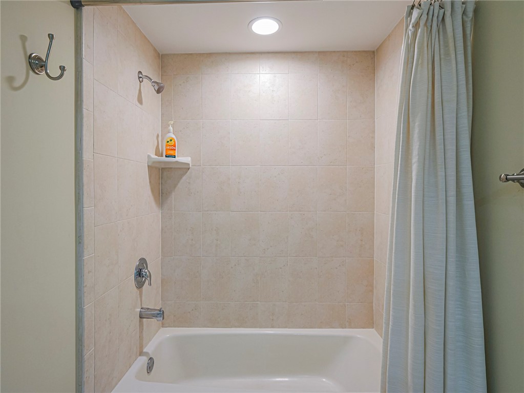 5060 Harmony Circle, Unit 304 Vero Beach, FL 32967 - Photo 29 of 36 a bathroom with a shower