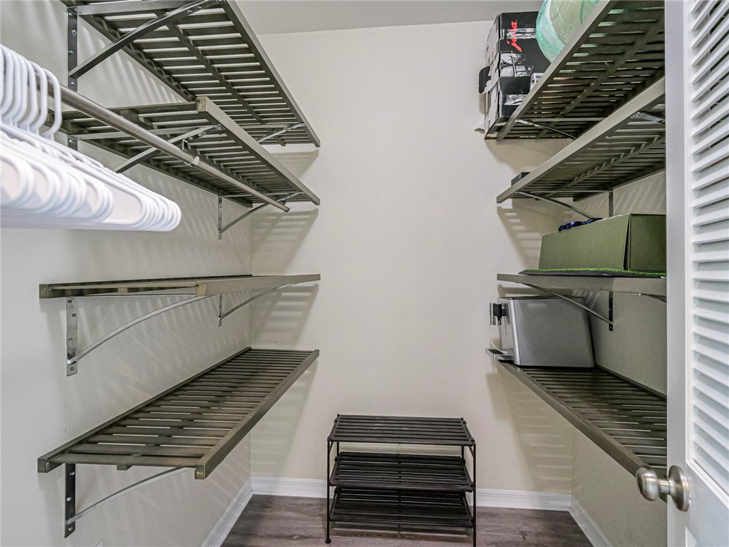 5060 Harmony Circle, Unit 304 Vero Beach, FL 32967 - Photo 30 of 36 a view of an empty room with wooden floor