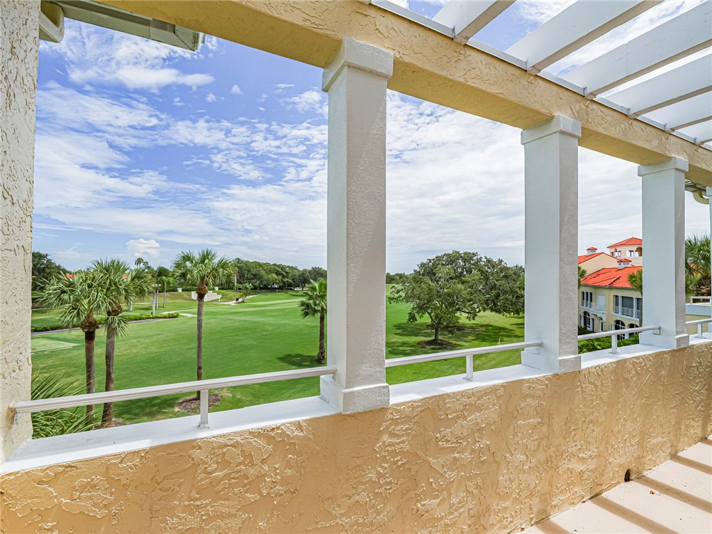 5060 Harmony Circle, Unit 304 Vero Beach, FL 32967 - Photo 36 of 36 a view of a garden with a large trees