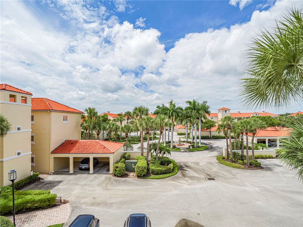 5060 Harmony Circle, Unit 304 Vero Beach, FL 32967 - Photo 6 of 36 an outdoor space with furniture and garden