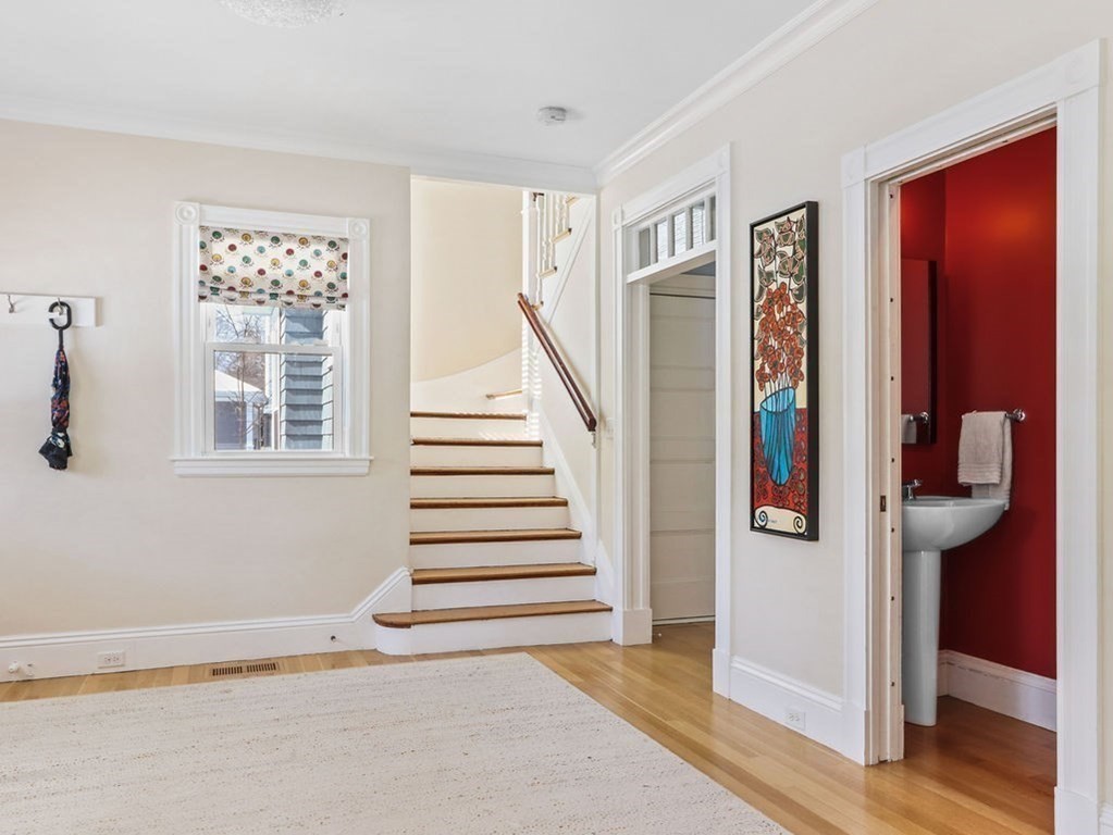 53 Marshall Street Newton, MA 02459 - Photo 12 of 42 a view of entryway and hall with wooden floor
