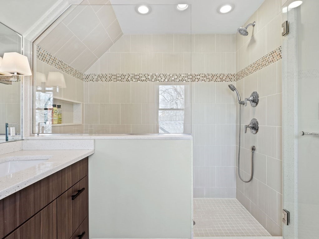 53 Marshall Street Newton, MA 02459 - Photo 20 of 42 a bathroom with a shower sink and mirror