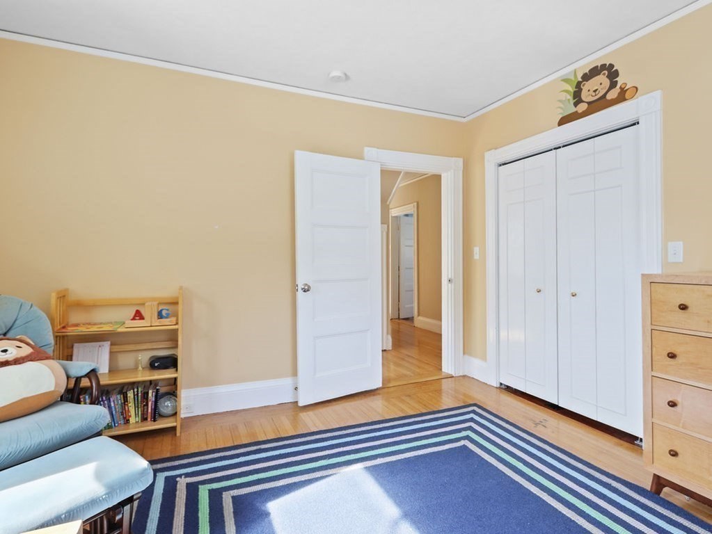 53 Marshall Street Newton, MA 02459 - Photo 26 of 42 a living room with furniture and a wooden floor