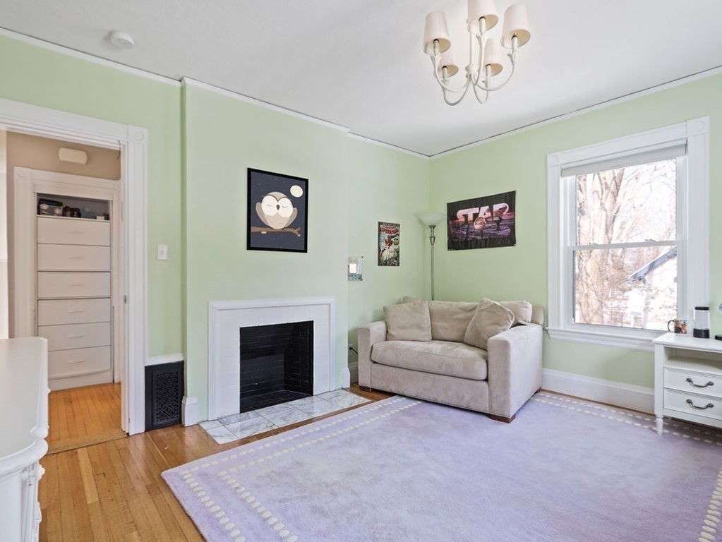 53 Marshall Street Newton, MA 02459 - Photo 28 of 42 a living room with furniture and a fireplace