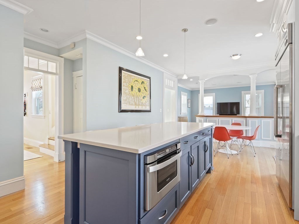53 Marshall Street Newton, MA 02459 - Photo 3 of 42 a kitchen with stainless steel appliances granite countertop a stove and a sink
