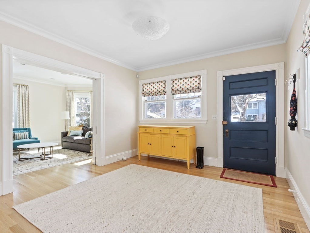 53 Marshall Street Newton, MA 02459 - Photo 33 of 42 wooden floor and windows in a room with a dresser