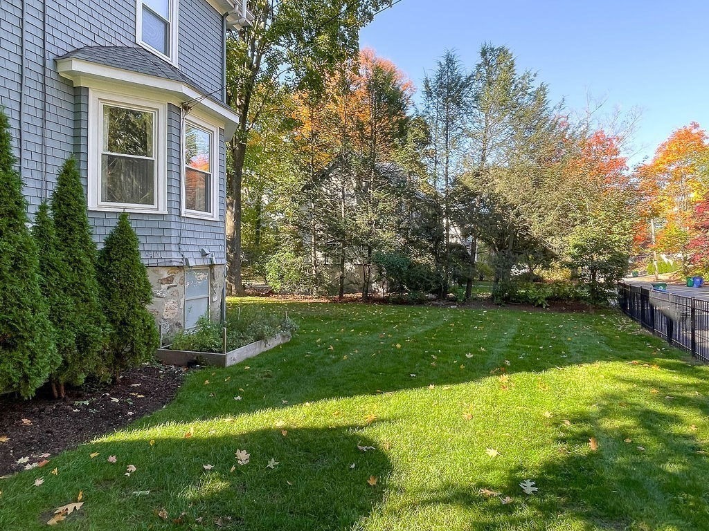 53 Marshall Street Newton, MA 02459 - Photo 40 of 42 a view of a backyard with plants and a garden