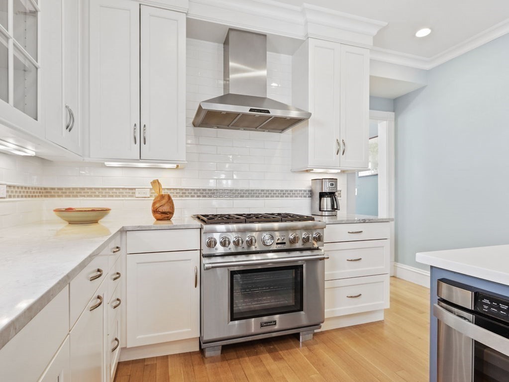 53 Marshall Street Newton, MA 02459 - Photo 4 of 42 a kitchen with granite countertop a stove and a sink