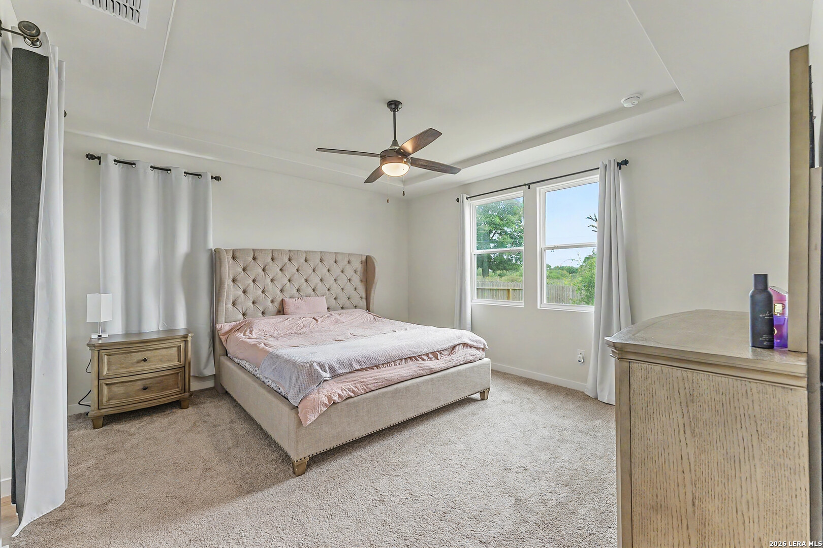 16515 Rosemary Ridge Elmendorf, TX 78112 - Photo 13 of 27 a spacious bedroom with a bed and a window