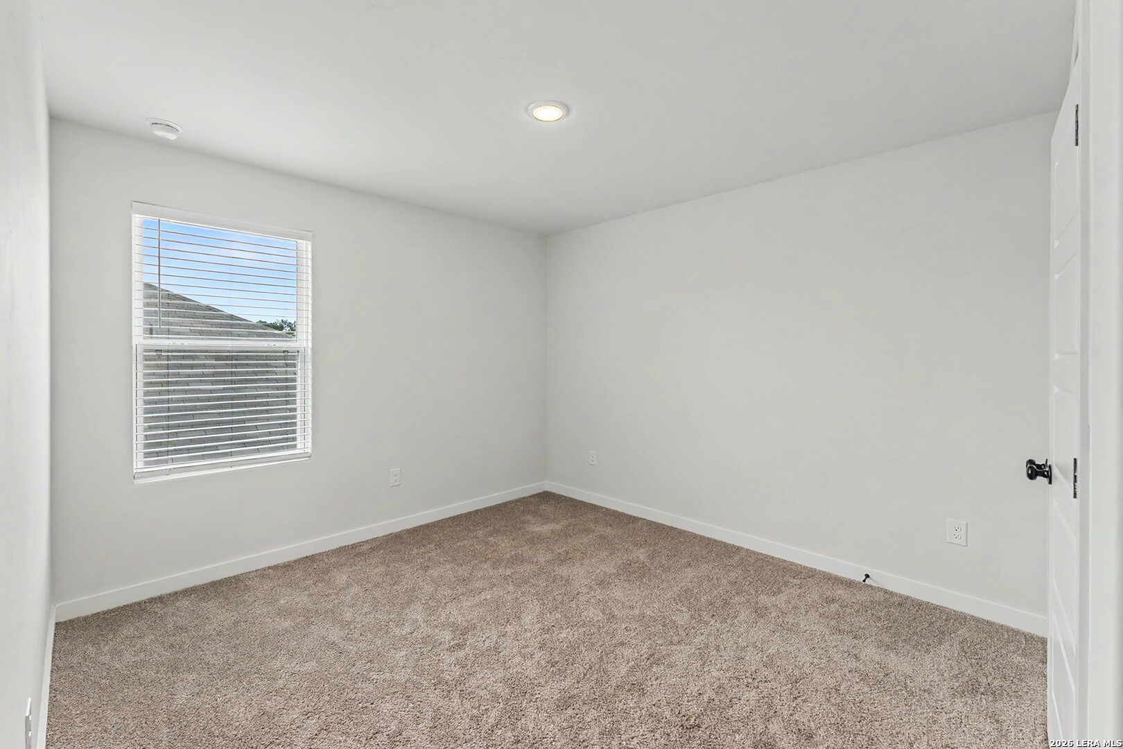 16515 Rosemary Ridge Elmendorf, TX 78112 - Photo 18 of 27 a view of an empty room with a window
