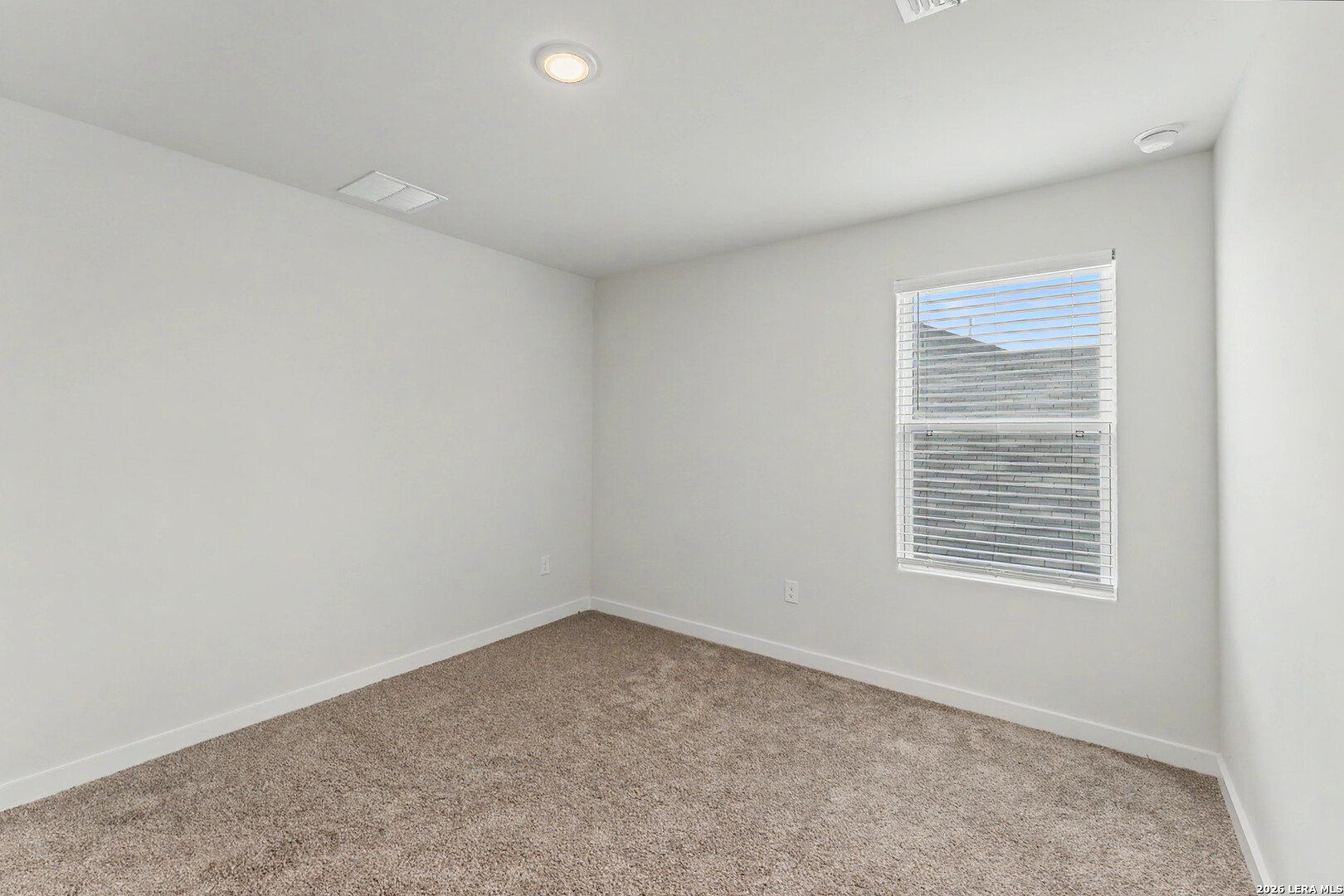 16515 Rosemary Ridge Elmendorf, TX 78112 - Photo 19 of 27 an empty room with a window