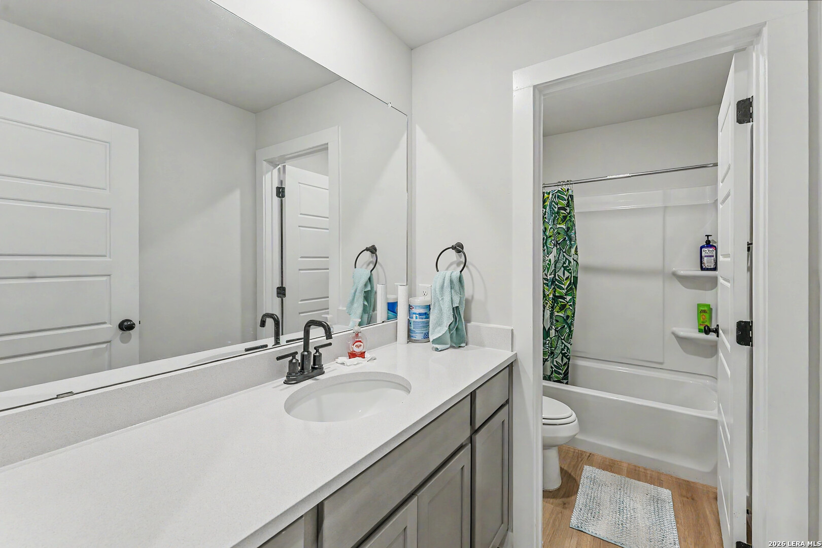 16515 Rosemary Ridge Elmendorf, TX 78112 - Photo 21 of 27 a bathroom with a sink a toilet and shower